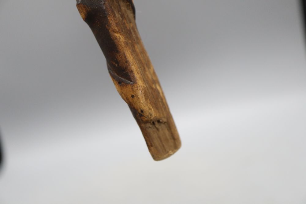 A carved fertility stick, c.1840, length 79cm